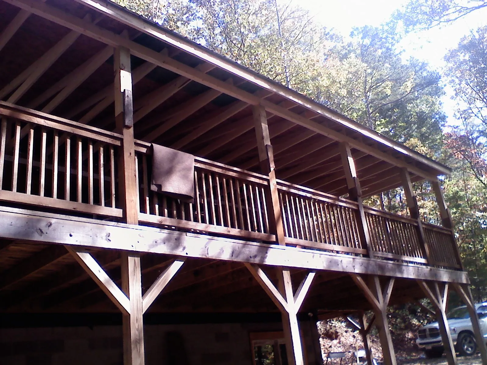 Timber framing under a new elevated porch and deck — Roof Leak Repair in Ola by Roofing Brothers